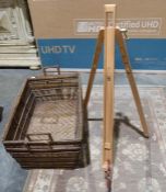 Two large wicker log/paper baskets and an easel