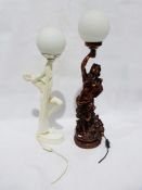 White painted ceramic art deco style nude female holding a lamp, and another table lamp formed as an