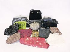 Three boxes of assorted handbags and purses