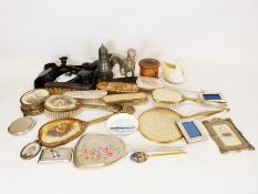 Ebony dressing table set, various brushes and mirrors, metal model gundog etc.