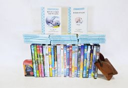 Box of various childrens DVDs and a set of Winnie the Pooh books