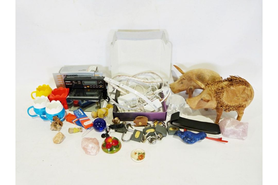 Box of various household items to include two wooden pig ornaments, a quartz radio, etc