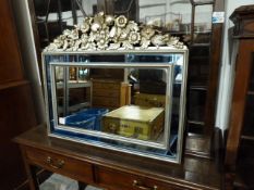 Two rectangular mirrors, one gilt framed, one silvered and moulded with fruit and flowers with a box