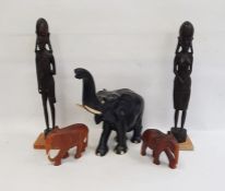 Large carved ebony model of an elephant, 34cm high, two more carved hardwood models of elephants and