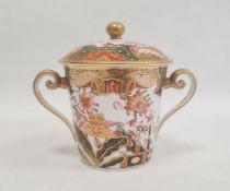 Spode two handled cup and cover, circa. 1820 of tapering form with scroll handles decorated in the