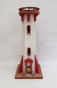 Wooden model of a lighthouse painted in red and white, 68cm high