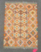 Chobi kilim rug in greens, oranges and blues on a cream ground, 116cm x 85cm.