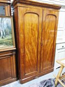 19th century mahogany converted wardrobe/shelving unit, the moulded cornice above two doors