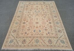 Large kilim, the central panel decorated with flowers with stylised flowers and plants within a wide