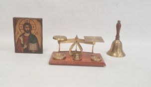 Pair of brass postal scales on rectangular wooden base, a brass bell with turned wooden handle and a