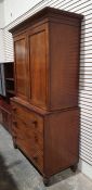 19th century mahogany linenpress, the moulded cornice above two flame mahogany doors enclosing