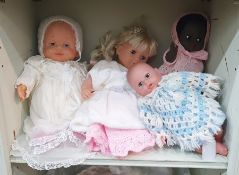 Four composition dolls and a quantity of dolls accessories