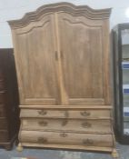 French style armoire, the moulded cornice above two cupboard doors enclosing shelves, the bombe