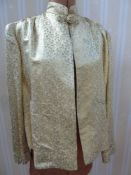 Chinese silk jacket, patterned in gold and silver thread, frog fastening
