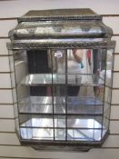 20th century Indian glass-shelved mirror with metal studded detail, with three mirrored shelves,