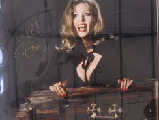 Ingrid Pitt signed and framed photograph, 29.5cm x 49cm