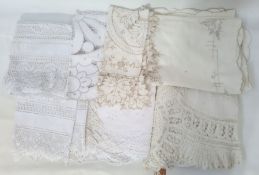 Three linen and lace tablecloths, 100cm x 120cm, an embroidered linen tablecloth, 130cm x 160cm, two