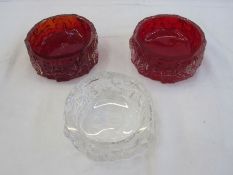 Two Whitefriars bark-effect red ashtrays and another clear glass bark-effect ashtray, 12cm