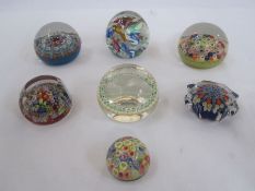 Strathearn millefiori paperweight, five other millefiori paperweights and a multi-coloured