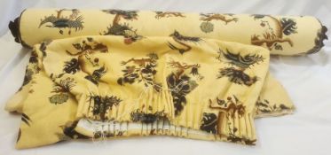 GP & J Baker 'Oberon' blue on yellow ground, a bolster 138cm in length with blue silk rosettes on