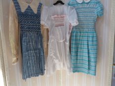 Three various child's dresses, circa 1950's with smocking and embroidered detail, a child's romper