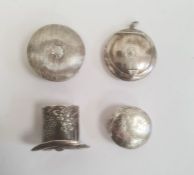 A Victorian silver trinket box in the shape of a top hat with repousse decoration of cherubs, gilded