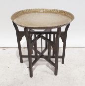 Eastern style brass tray on folding stand