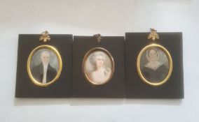 Pair of portrait miniatures on ivory, oval, head and shoulders portraits of a lady and gentleman,