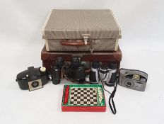 Pair of Dunhill Eagle 12x30 binoculars in leather case, a travelling chess set, a small vintage