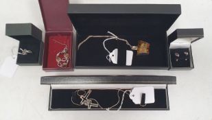 A small quantity of silver jewellery to include silver mounted amber pendant on chain, cross pendant