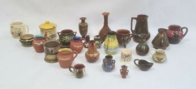 Stapleton pottery jug and vase with marbled glaze, a Torquay pottery motto ware preserve jar and