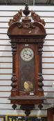 Walnut Vienna regulator Roman numerals to the enamel dial, 115cm tall