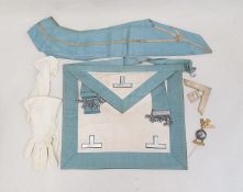 Old brown leather case of masonic regalia to include sash, enamelled badge, white metal pendant