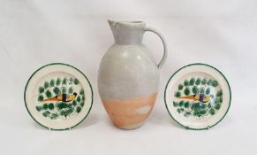 Pair of nineteenth century pottery plates decorated with yellow and brown birds, within green