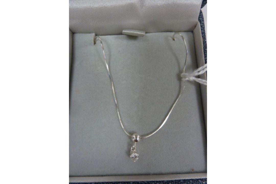 Solitaire diamond drop pendant, claw-set in silver mount, on fine chain, the stone approx 0.10ct - Image 2 of 4