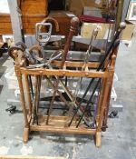 Stickstand and contents including a turned ebony stick, a stick with silver finial, shooting sticks,