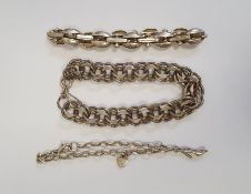 Silver bracelet of multiple interlocking links, another silver-coloured bracelet of oval and bar