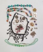 Shell cameo brooch, a hardstone necklace, a faceted green glass bead necklace and various other