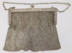 An early 20th century silver chain purse, with import marks, marked 925, foliate detail to clutch,