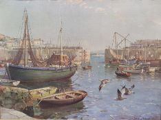 Oval mirror and a convex circular mirror in gilt frames and two framed prints of harbour scenes