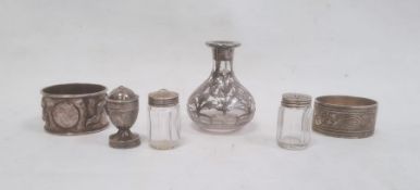 A Chinese silver napkin ring, relief decoration of dragon, 1ozt approx. a silver-coloured oval