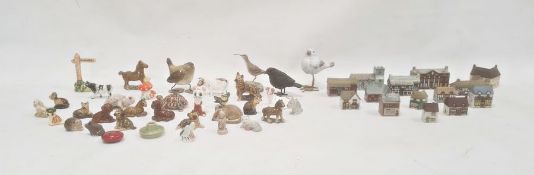 Quantity of Wade miniature model buildings including a church, a water mill, houses, etc and various