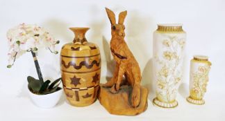 Carved wooden sculpture of a hare, a wooden vase, two porcelain vases with applied flower decoration