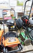 Black and Decker electric rotary lawn rake together with a Veri-Green 12-inch manual cylinder lawn