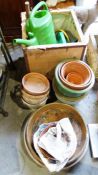 Collection of plant pots together with various garden tools, hosepipe and watering can, two sections