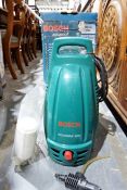 Bosch Aquatack 100 pressure washer and a Black and Decker hedge cutter