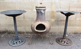 Mexican-style clay tone outdoor cheminea and two plastic birdbaths (3)
