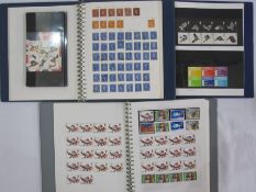 Two boxes with decimal mint stamps, face value £350 approx. in three albums and plastic bags, a