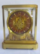 Atmos Jaeger-Le-Coultre clock in brass and glazed case, serial no. 75177, with customer's