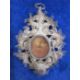 Victorian silver filigree reliquary pendant with central oval glass enclosing writing on paper - Image 2 of 2